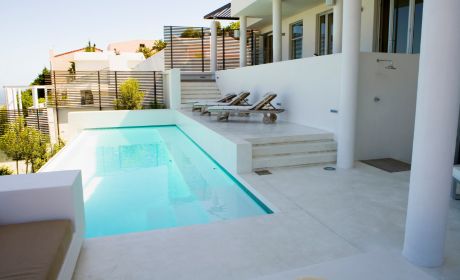 A view at a modern backyard with a pool