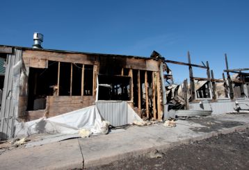 Restoration team cleaning smoke and soot damage after a fire in a Granada Hills home.